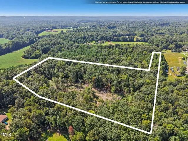 a bathroom with a double vanity sink mirror and bathtub