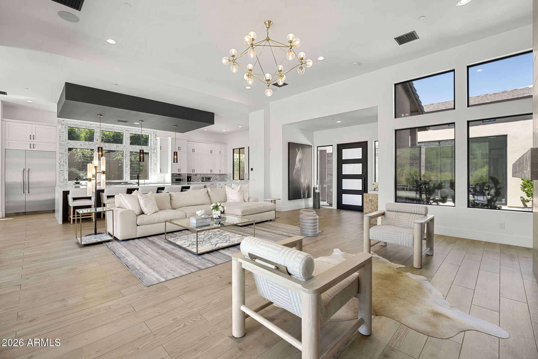 13267 East Ranch Gate Road Scottsdale, AZ 85255 - Photo 18 of 84 a living room with fireplace furniture and a chandelier