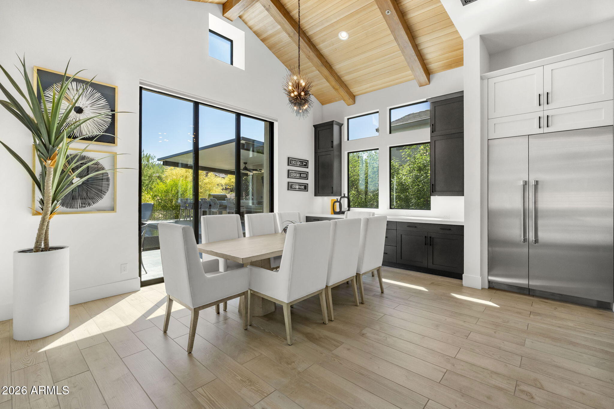 13267 East Ranch Gate Road Scottsdale, AZ 85255 - Photo 24 of 84 a view of a dining room with furniture window and wooden floor