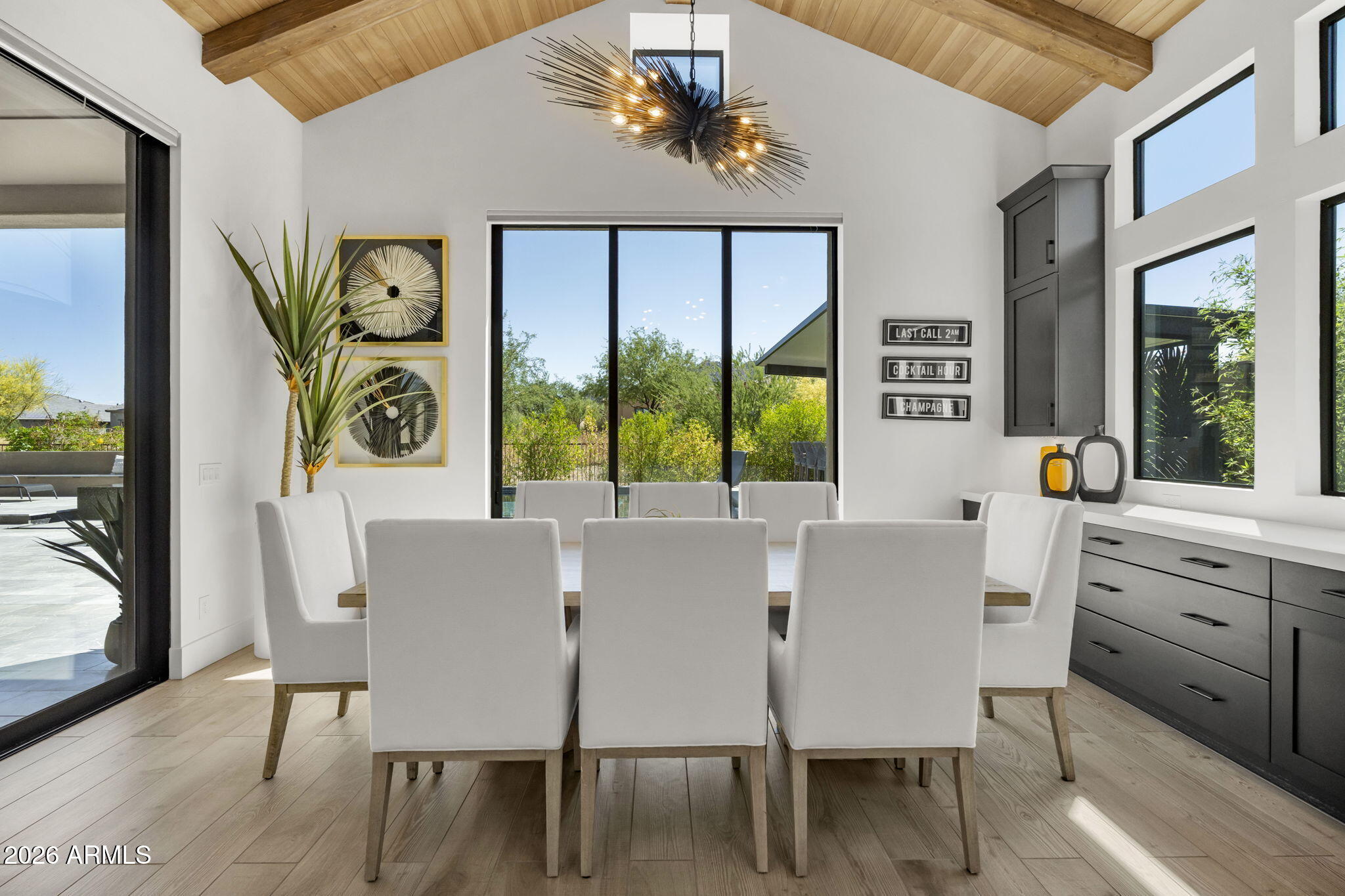 13267 East Ranch Gate Road Scottsdale, AZ 85255 - Photo 25 of 84 a view of a dining room with furniture window and wooden floor