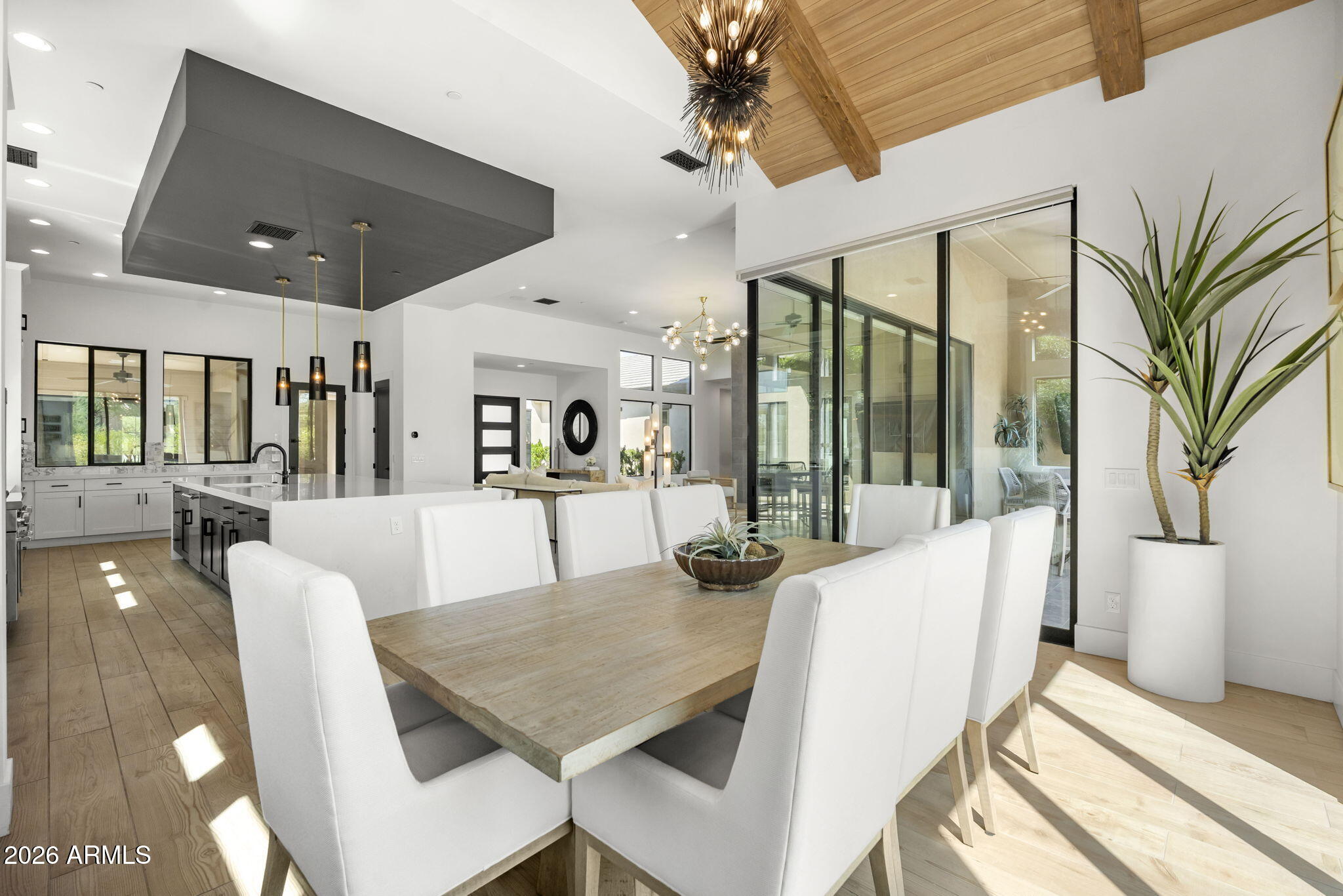 13267 East Ranch Gate Road Scottsdale, AZ 85255 - Photo 26 of 84 a dining room with furniture a chandelier and window