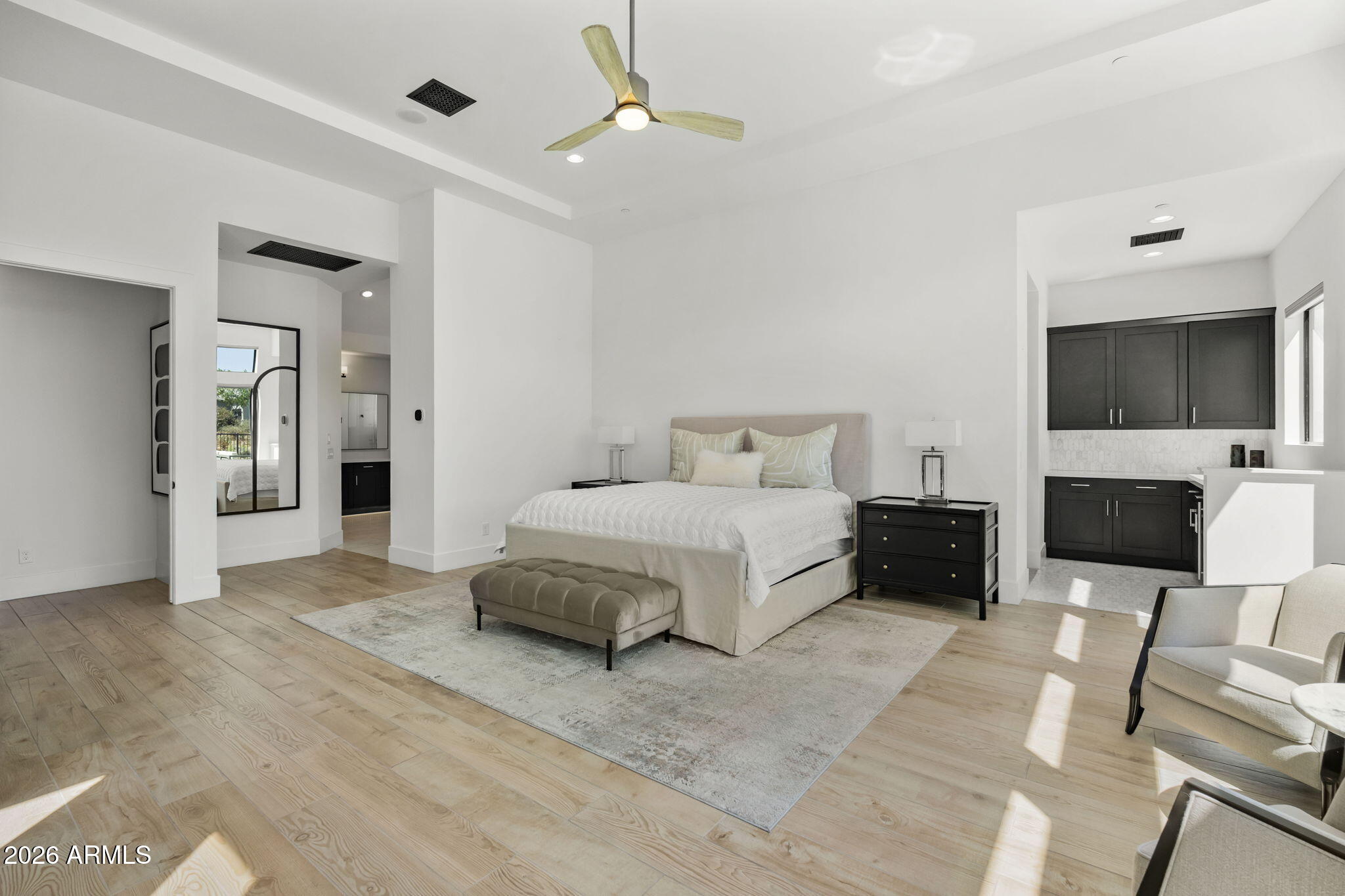 13267 East Ranch Gate Road Scottsdale, AZ 85255 - Photo 34 of 84 a spacious bedroom with a bed and a flat screen television
