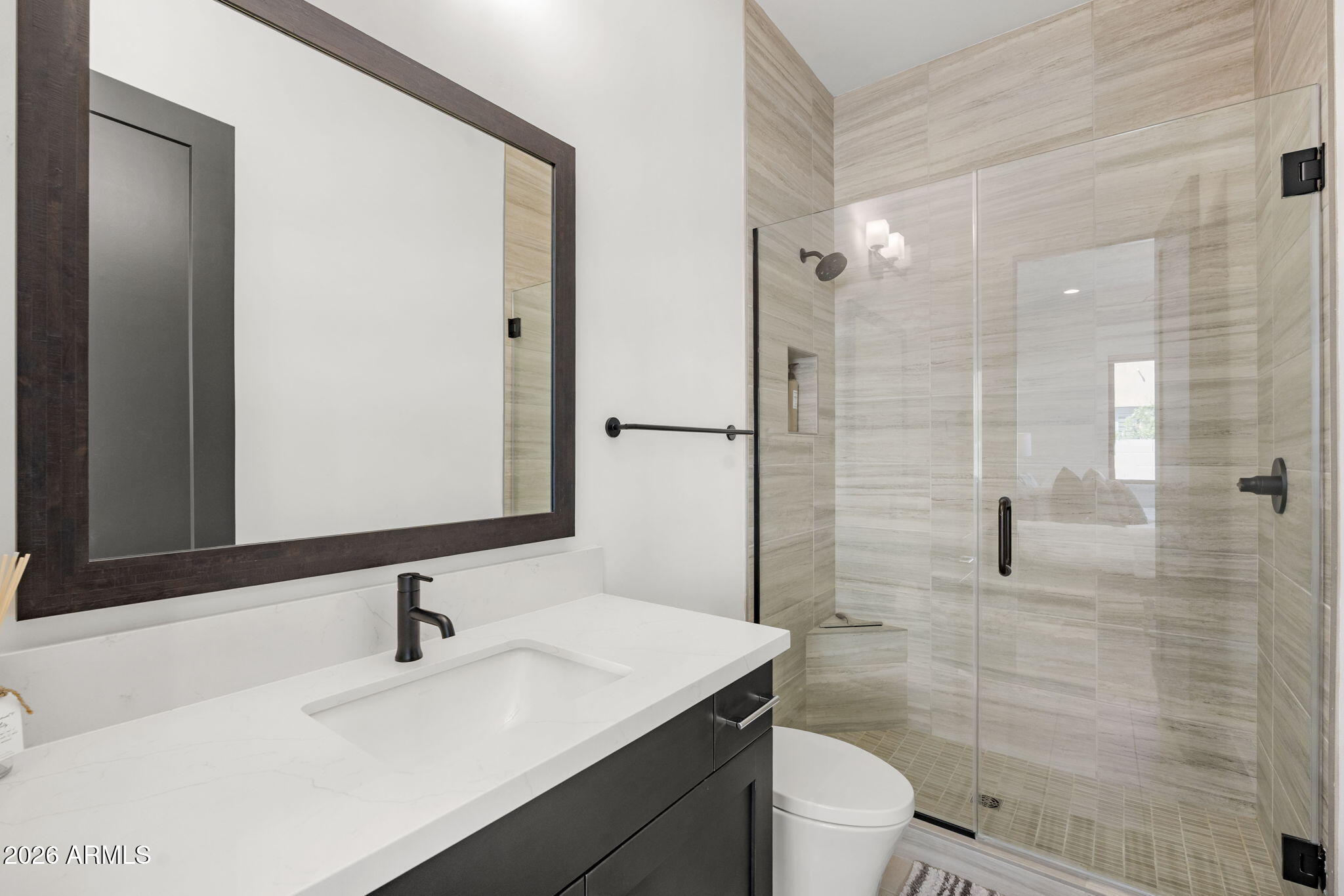 13267 East Ranch Gate Road Scottsdale, AZ 85255 - Photo 47 of 84 a bathroom with a sink a toilet and shower