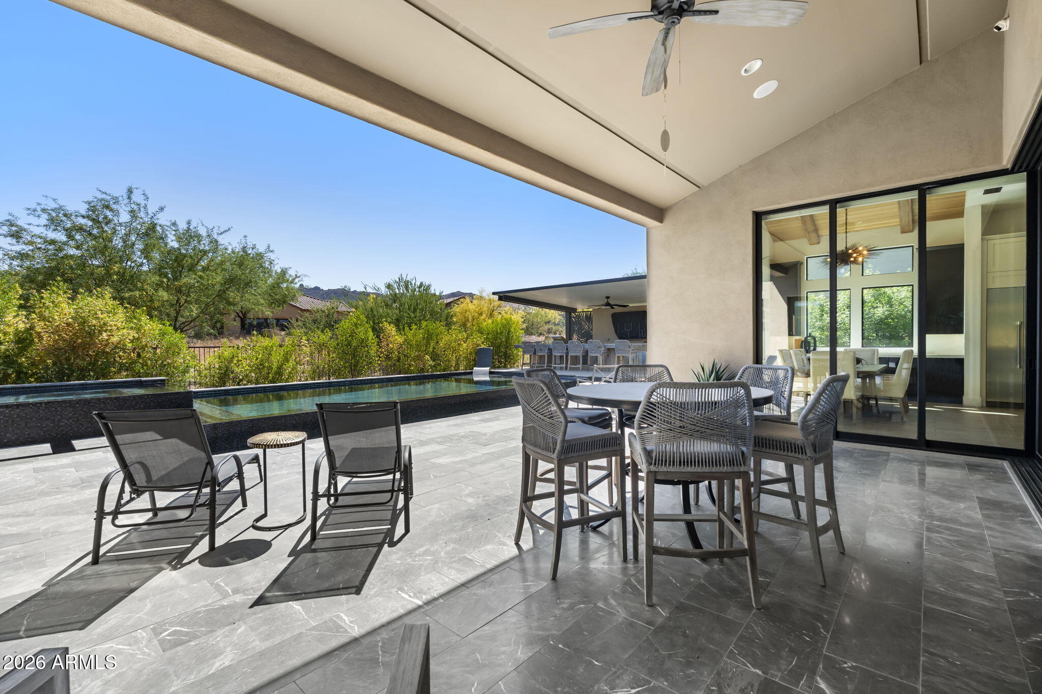 13267 East Ranch Gate Road Scottsdale, AZ 85255 - Photo 54 of 84 a view of a patio with a table and chairs