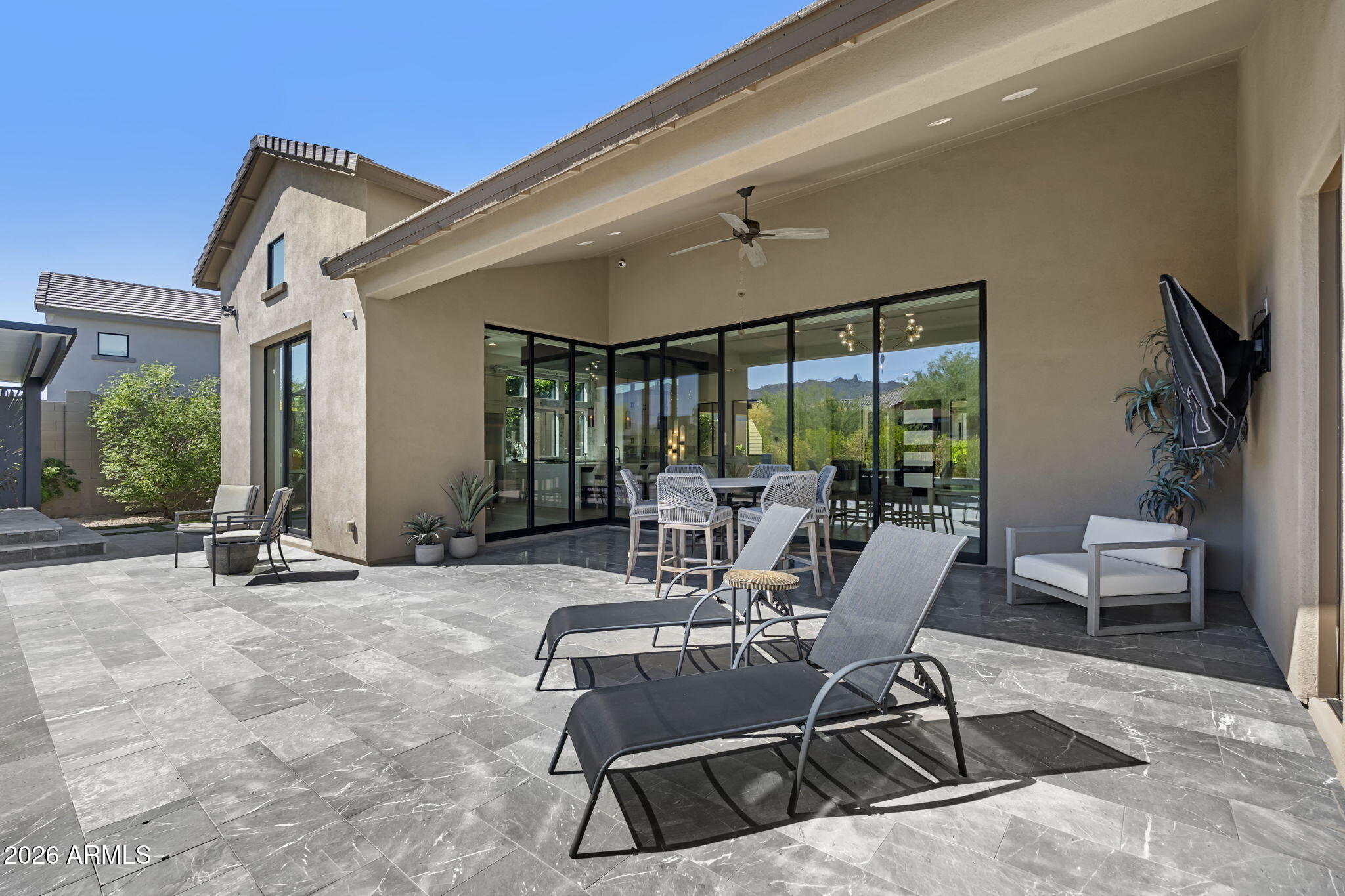 13267 East Ranch Gate Road Scottsdale, AZ 85255 - Photo 55 of 84 a building outdoor space with patio furniture and potted plants