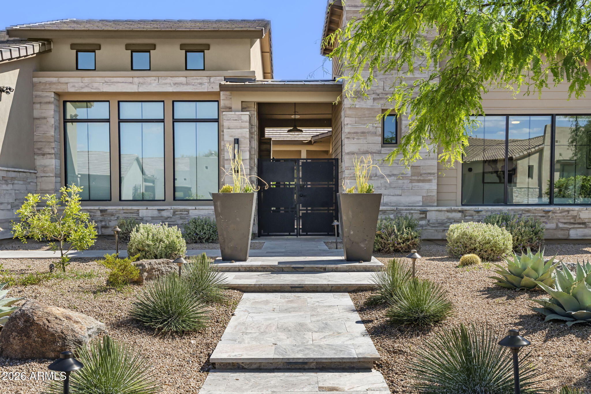 13267 East Ranch Gate Road Scottsdale, AZ 85255 - Photo 6 of 84 a front view of a house with a yard