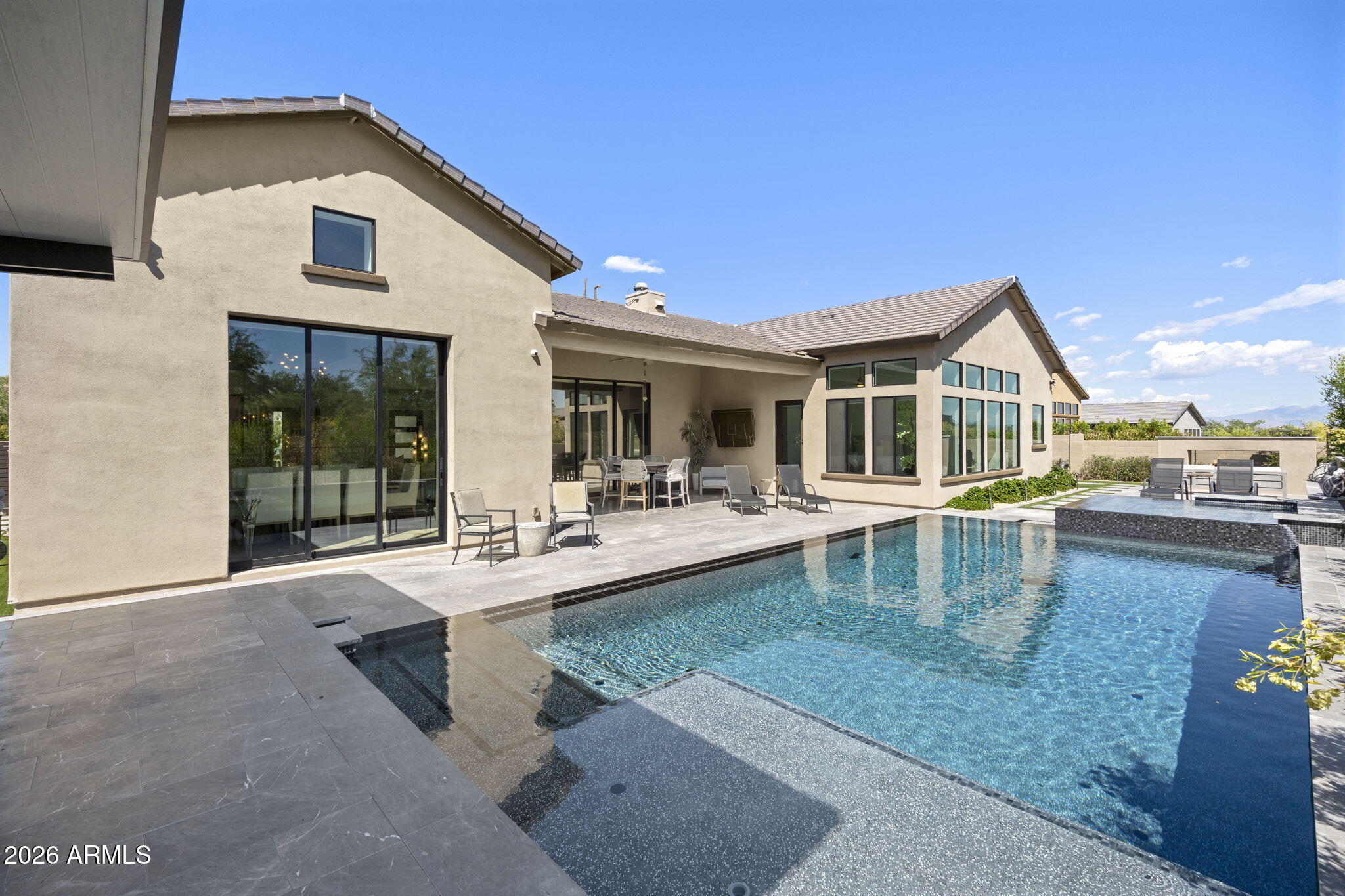13267 East Ranch Gate Road Scottsdale, AZ 85255 - Photo 65 of 84 a view of a house with swimming pool and sitting area