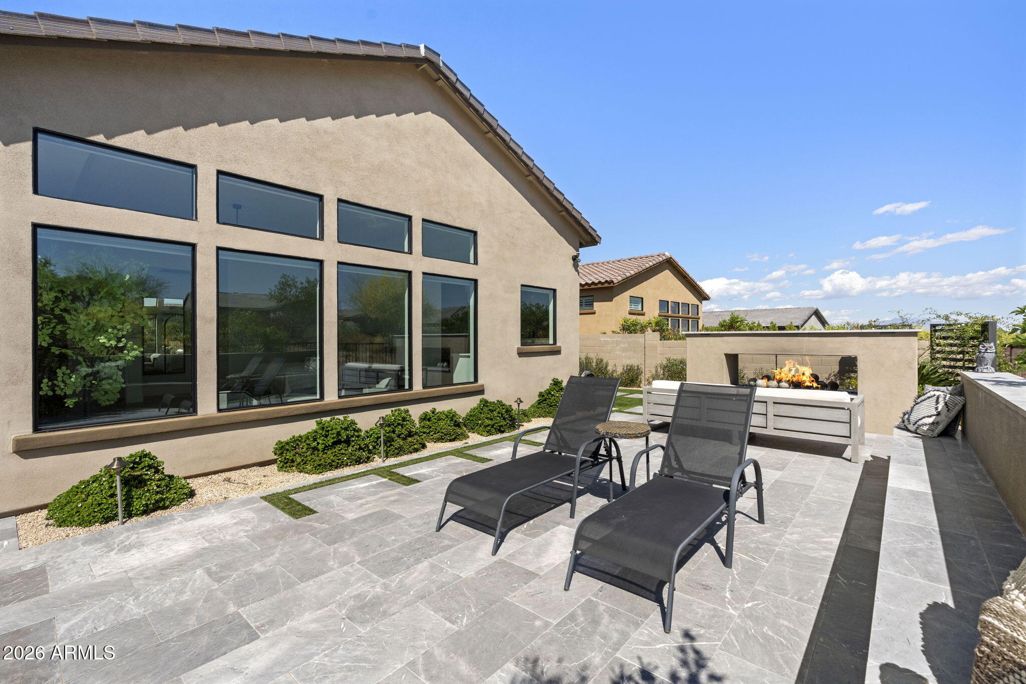 13267 East Ranch Gate Road Scottsdale, AZ 85255 - Photo 68 of 84 a view of a patio with couches table and chairs with wooden floor and fence