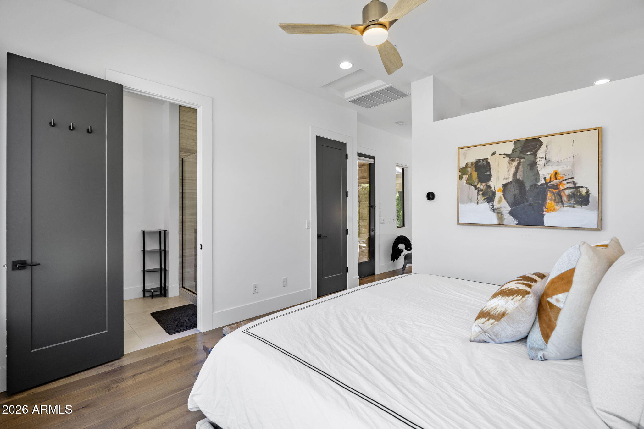 13267 East Ranch Gate Road Scottsdale, AZ 85255 - Photo 76 of 84 a bedroom with a bed and a painting on the wall