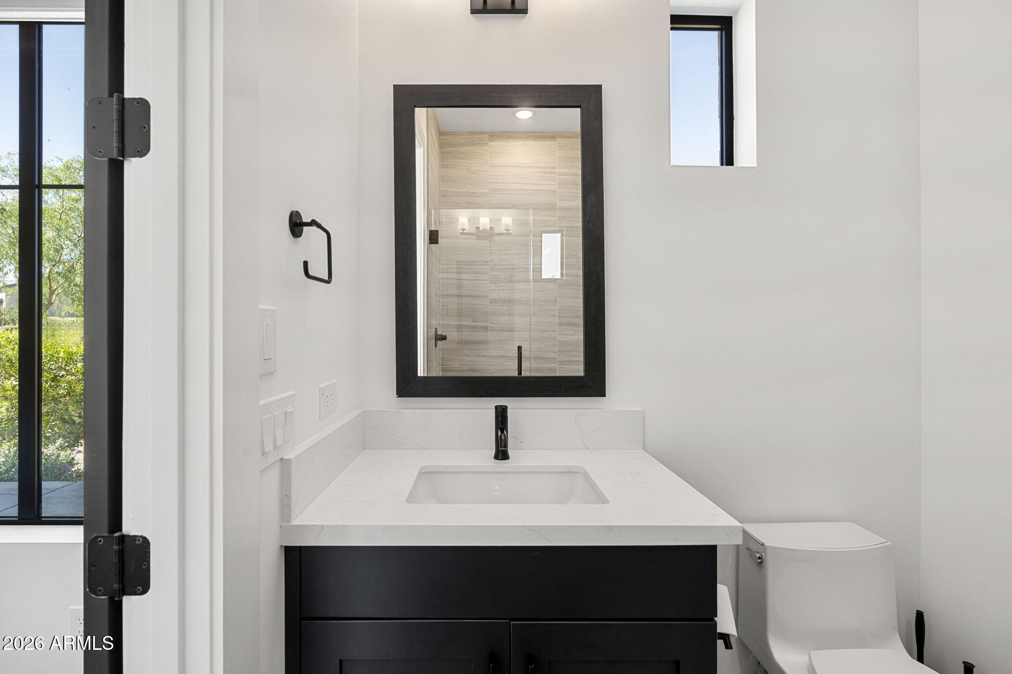 13267 East Ranch Gate Road Scottsdale, AZ 85255 - Photo 77 of 84 a bathroom with a sink and a mirror