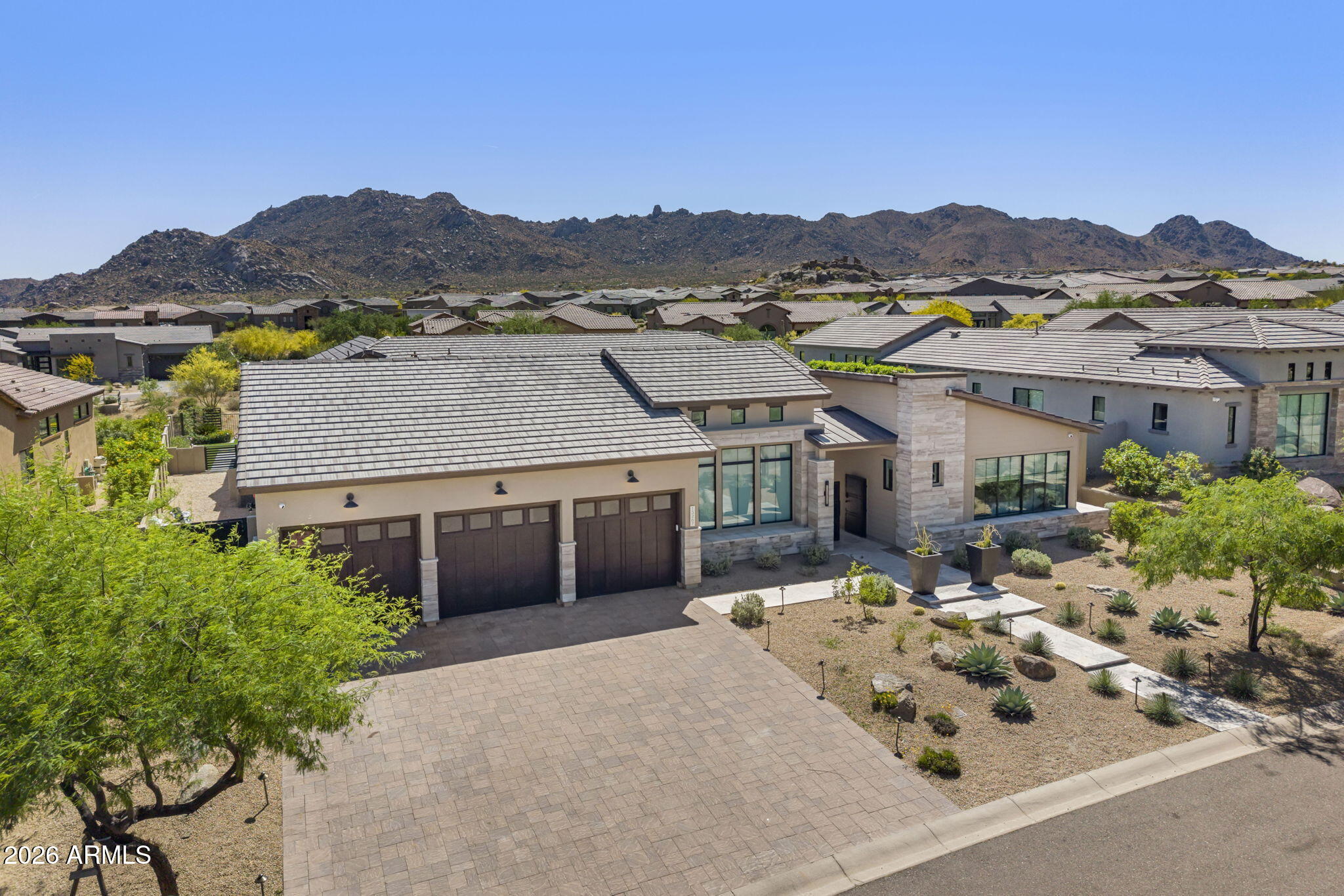13267 East Ranch Gate Road Scottsdale, AZ 85255 - Photo 80 of 84 an aerial view of a house with a mountain in the background