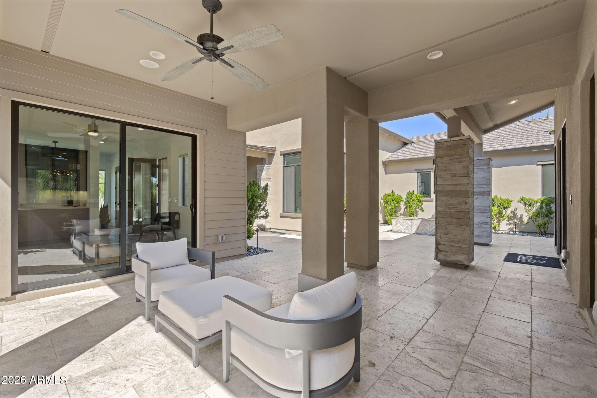 13267 East Ranch Gate Road Scottsdale, AZ 85255 - Photo 10 of 84 a living room with couches and glass door with glass windows