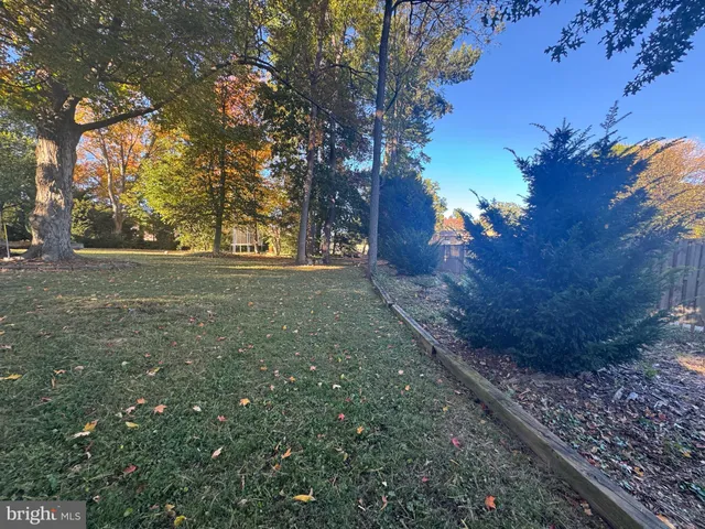 a view of a big yard with a house