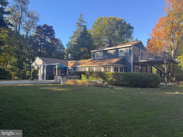 a kitchen with a table chairs and a refrigerator
