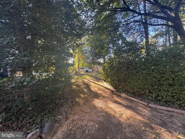 a bedroom with two beds and a window