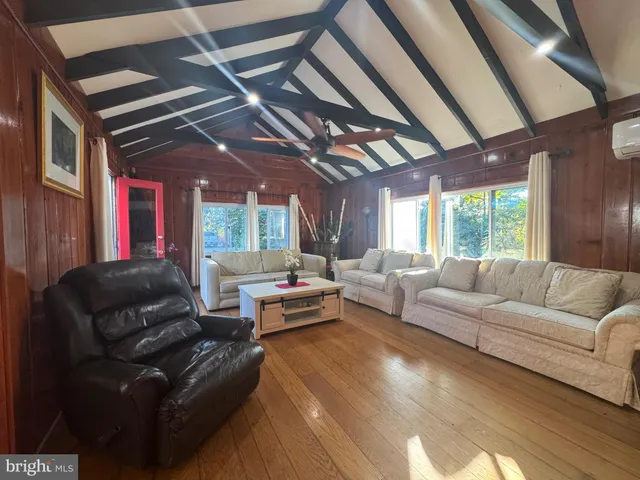 a view of a deck with wooden floor and outdoor seating