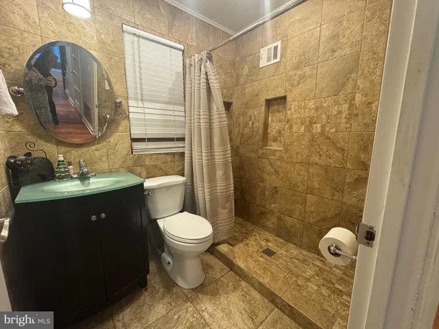 a view of a livingroom with furniture and a table