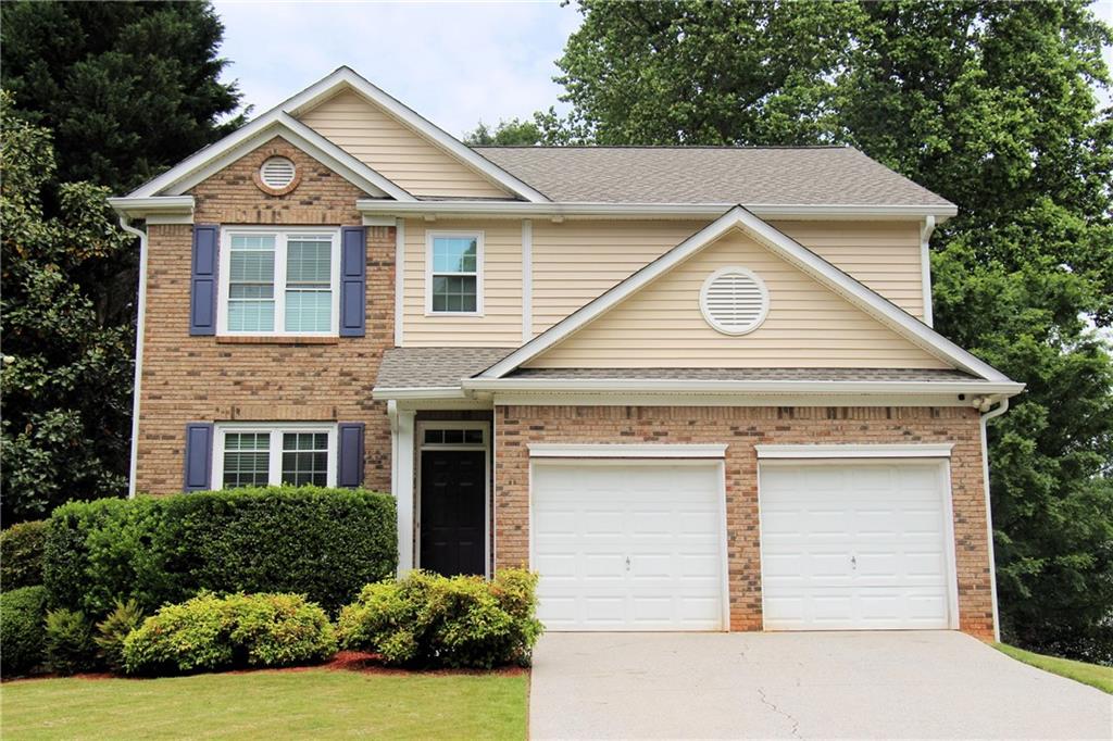 851 Tree Fern Way Southeast Mableton, GA 30126 - Photo 1 of 1 a front view of a house with yard and garage