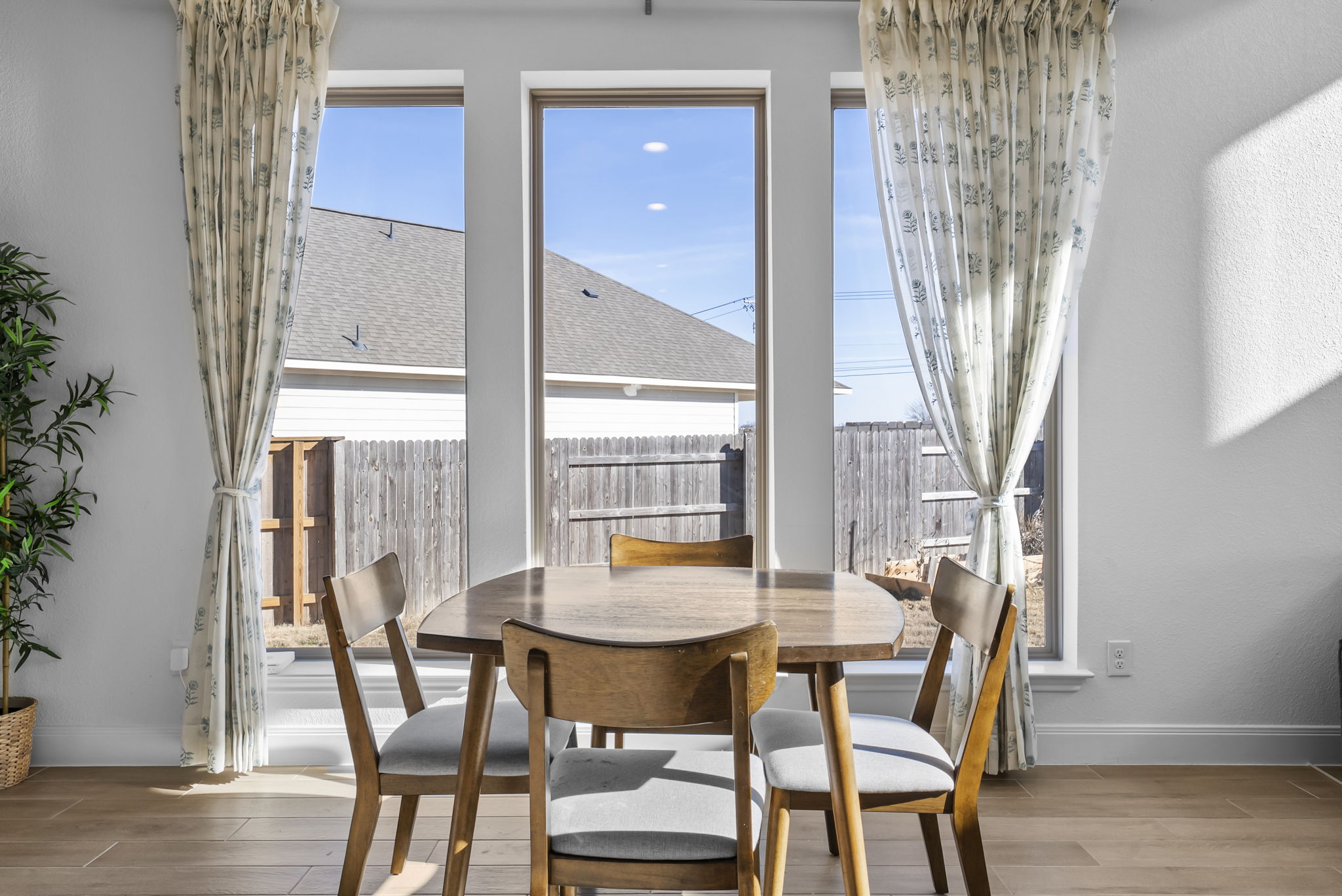 200 Marvins Bend Georgetown, TX 78626 - Photo 10 of 38 a view of a dining room with furniture and wooden floor