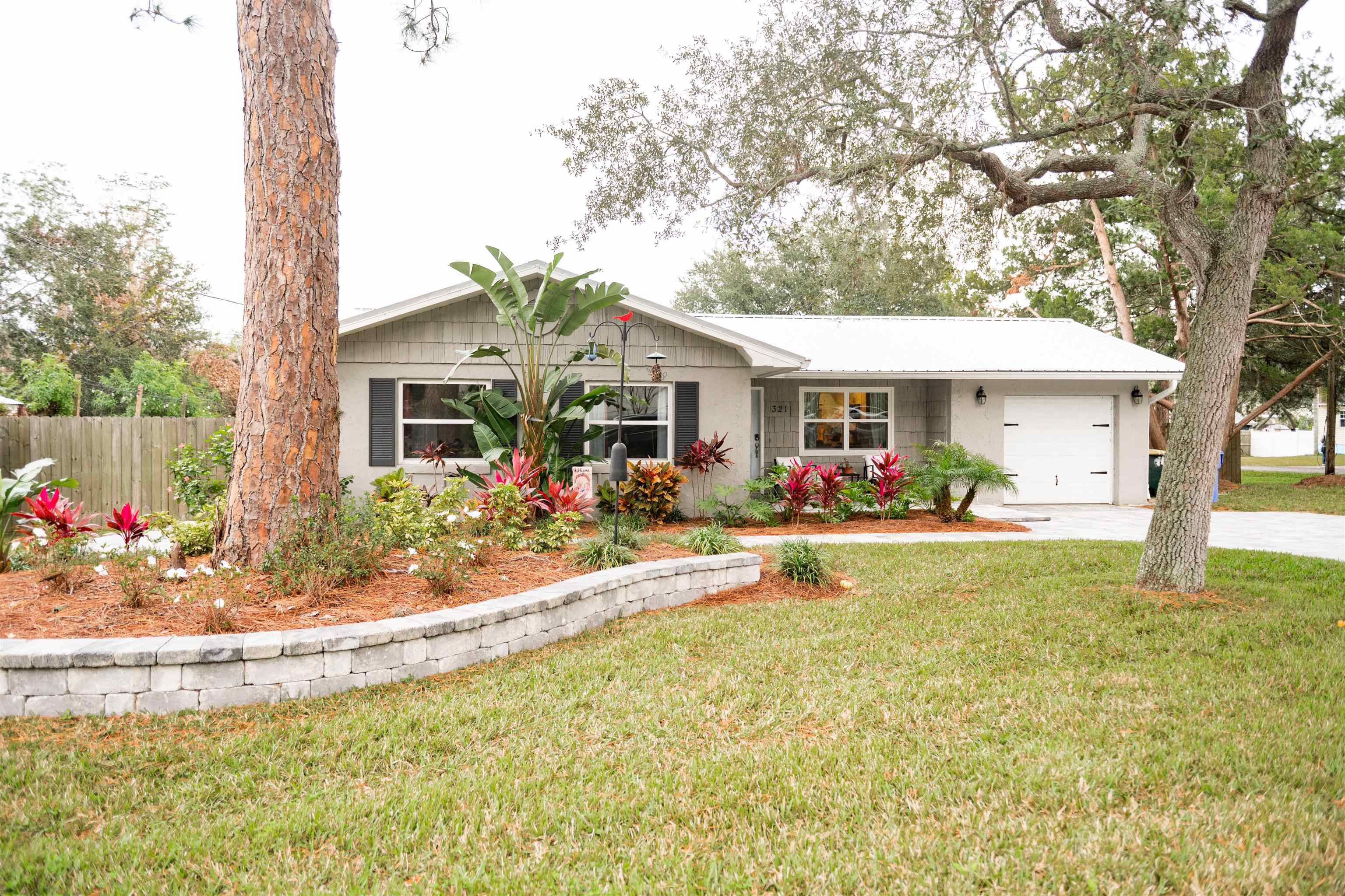 a view of a house with swimming pool and a porch with furniture