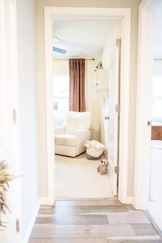 a view of a room with furniture and windows