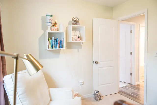 a bathroom with a sink mirror and toilet