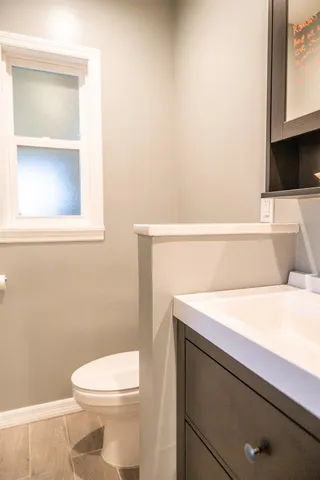 a bathroom with a sink and a window