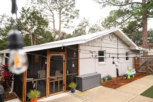a view of swimming pool with a bench in the background