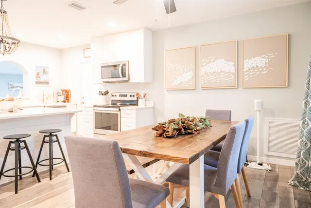 a dining room with furniture and window