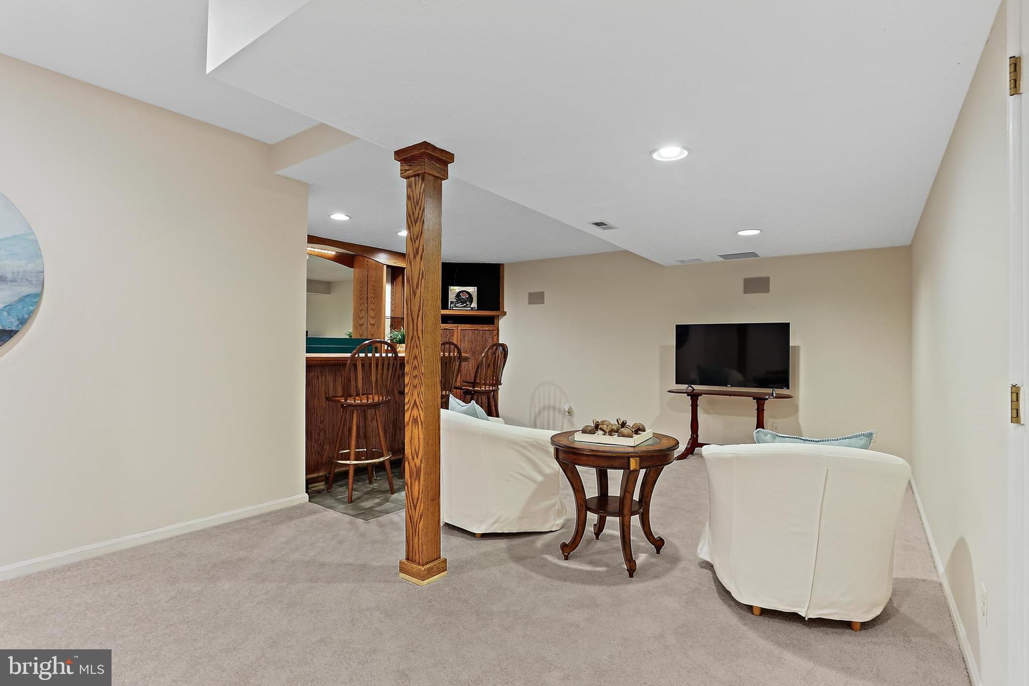 2111 Stonewall Road Baltimore, MD 21228 - Photo 40 of 58 a room with furniture and a flat screen tv
