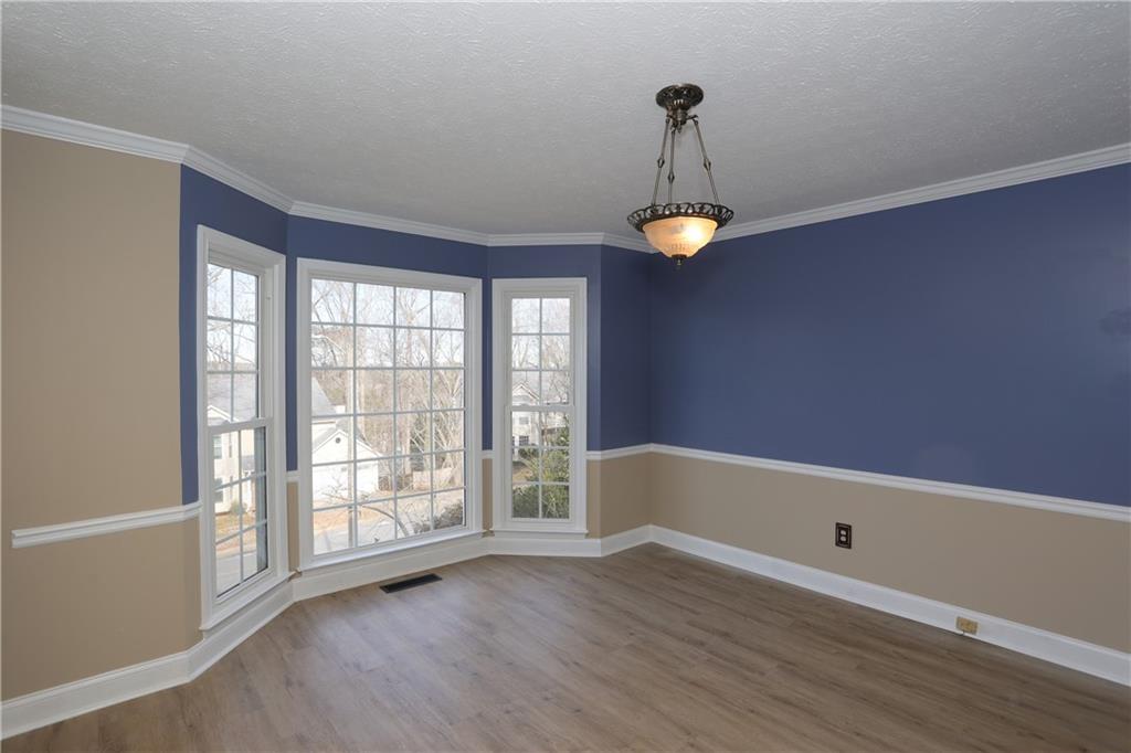 4981 Shallow Ridge Road Northeast Kennesaw, GA 30144 - Photo 18 of 36 a view of room with window and wooden floor