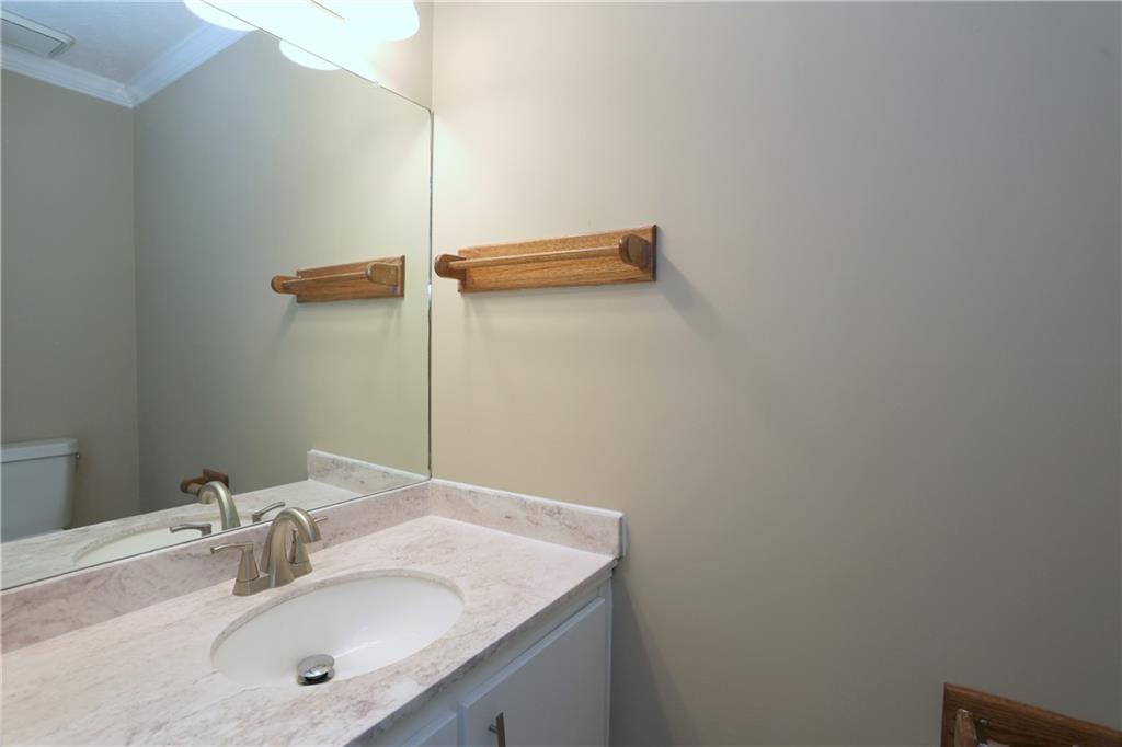 4981 Shallow Ridge Road Northeast Kennesaw, GA 30144 - Photo 20 of 36 a bathroom with a sink and a mirror