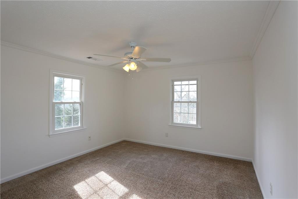 4981 Shallow Ridge Road Northeast Kennesaw, GA 30144 - Photo 29 of 36 an empty room with windows