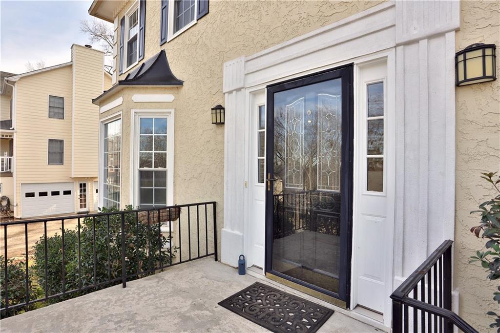 4981 Shallow Ridge Road Northeast Kennesaw, GA 30144 - Photo 3 of 36 a view of a glass door with a glass door