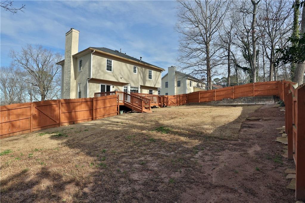 4981 Shallow Ridge Road Northeast Kennesaw, GA 30144 - Photo 5 of 36 a view of a house with a snow in the yard