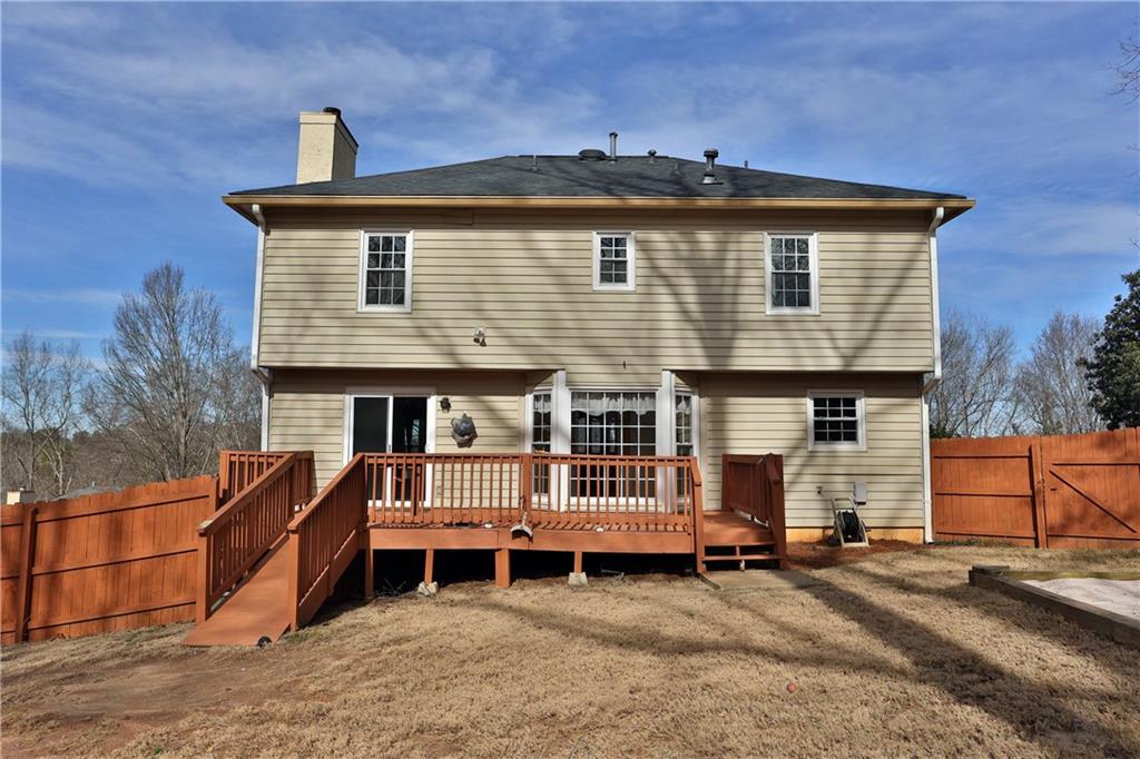 4981 Shallow Ridge Road Northeast Kennesaw, GA 30144 - Photo 6 of 36 a front view of a house with a yard