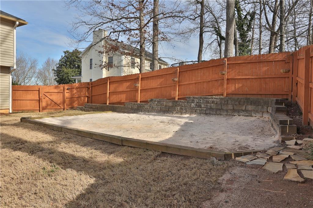 4981 Shallow Ridge Road Northeast Kennesaw, GA 30144 - Photo 7 of 36 a view of a backyard of the house
