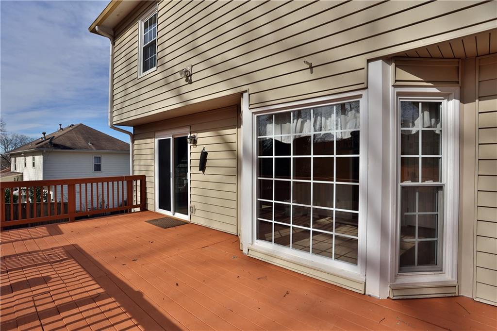 4981 Shallow Ridge Road Northeast Kennesaw, GA 30144 - Photo 9 of 36 a view of a house with a large window and wooden floor