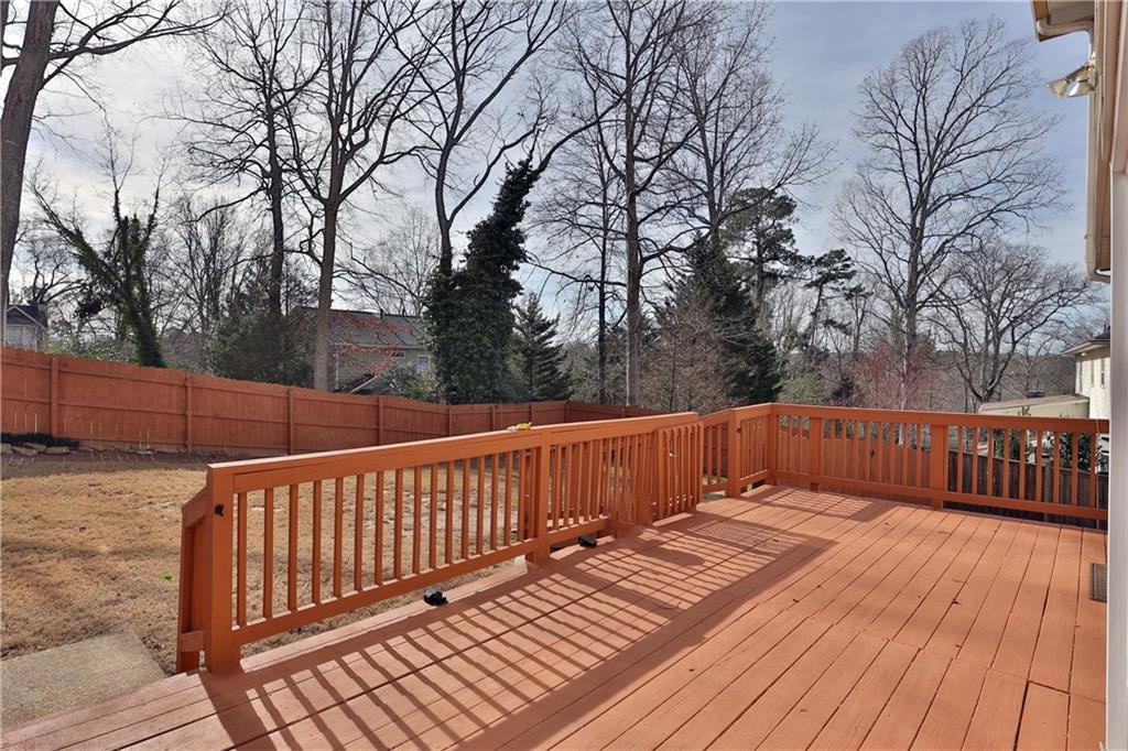 4981 Shallow Ridge Road Northeast Kennesaw, GA 30144 - Photo 10 of 36 a view of deck with wooden floor and trees