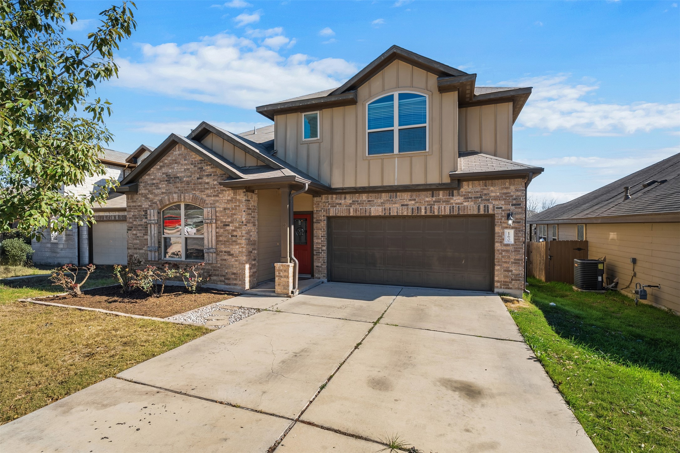 160 Albatross Cove Buda, TX 78610 - Photo 1 of 1 a front view of a house with a yard