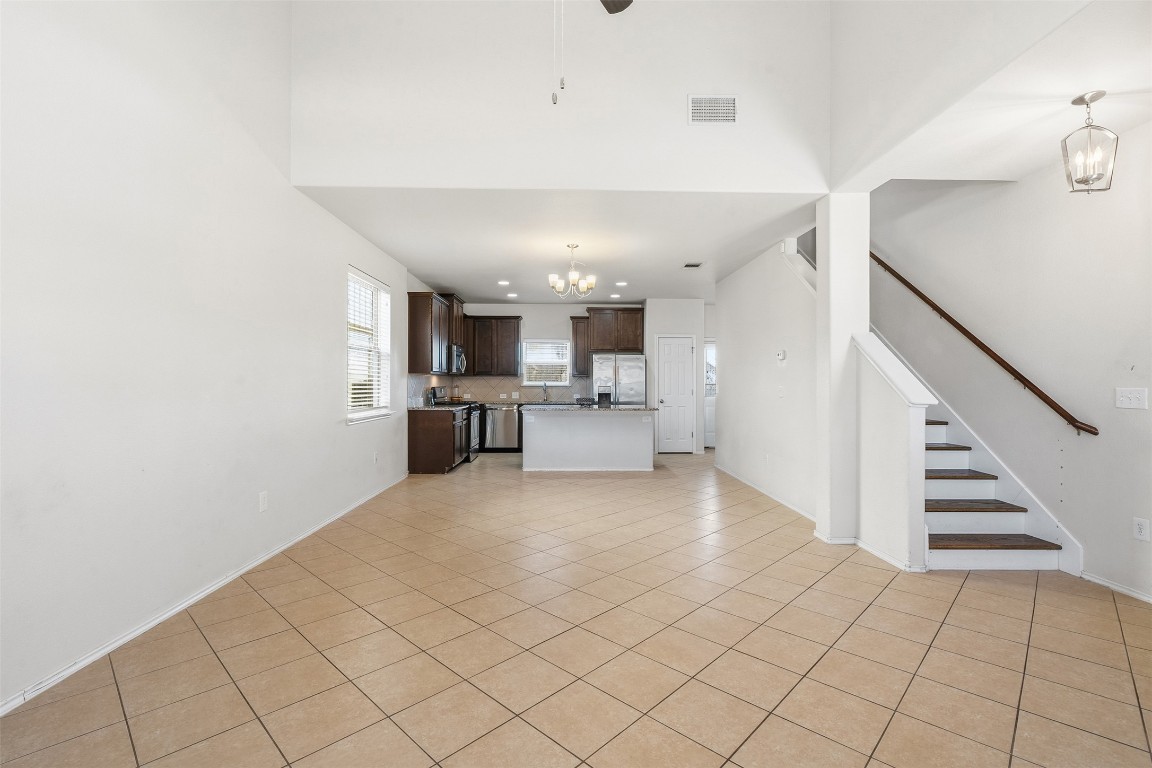 160 Albatross Cove Buda, TX 78610 - Photo 12 of 36 a view of a kitchen with furniture and an empty room