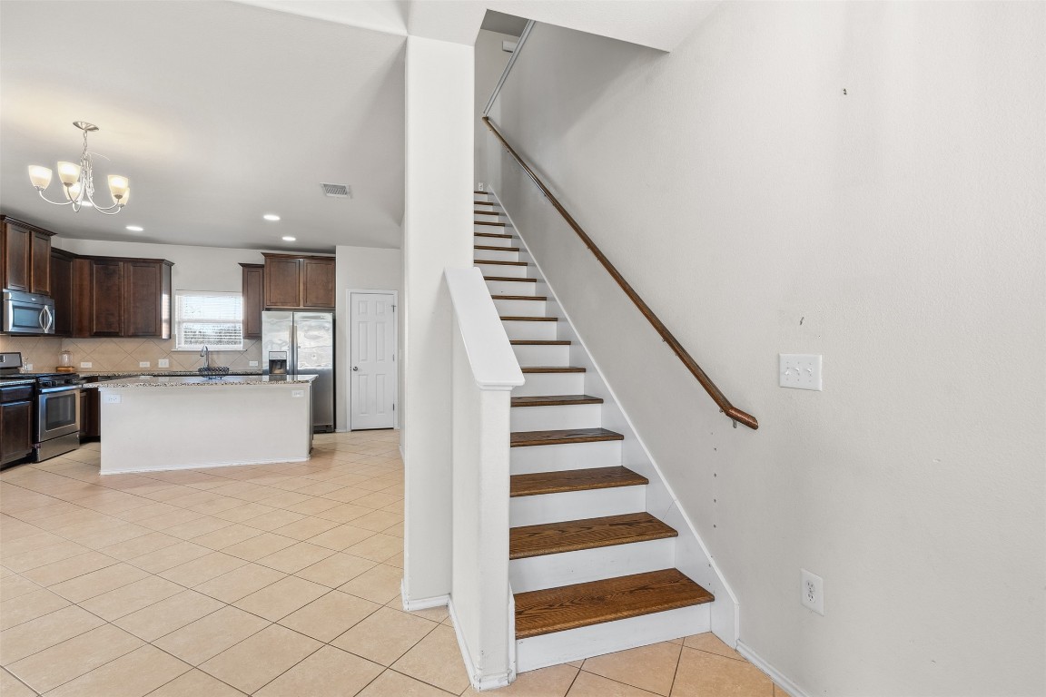 160 Albatross Cove Buda, TX 78610 - Photo 14 of 36 a view of kitchen with sink and microwave