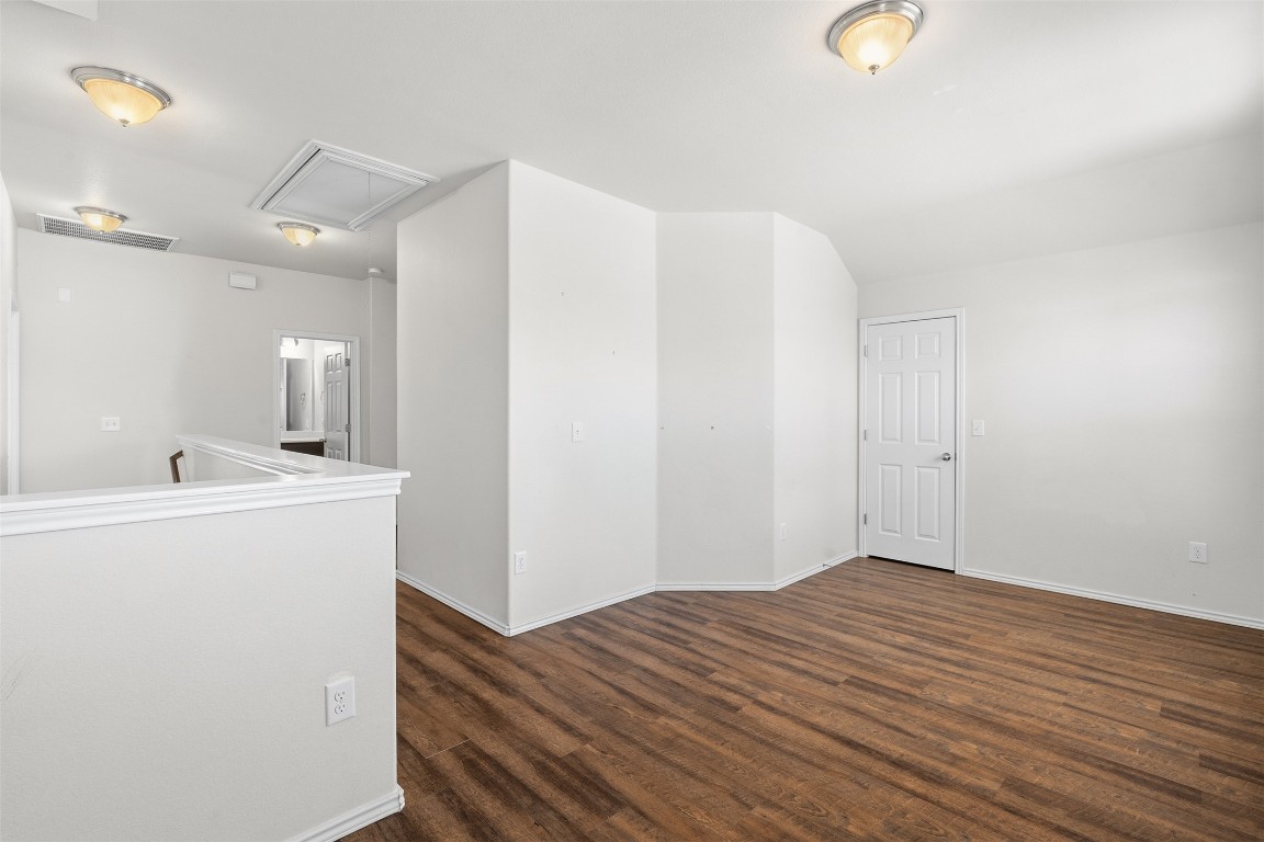 160 Albatross Cove Buda, TX 78610 - Photo 16 of 36 a view of a room with wooden floor and bathroom