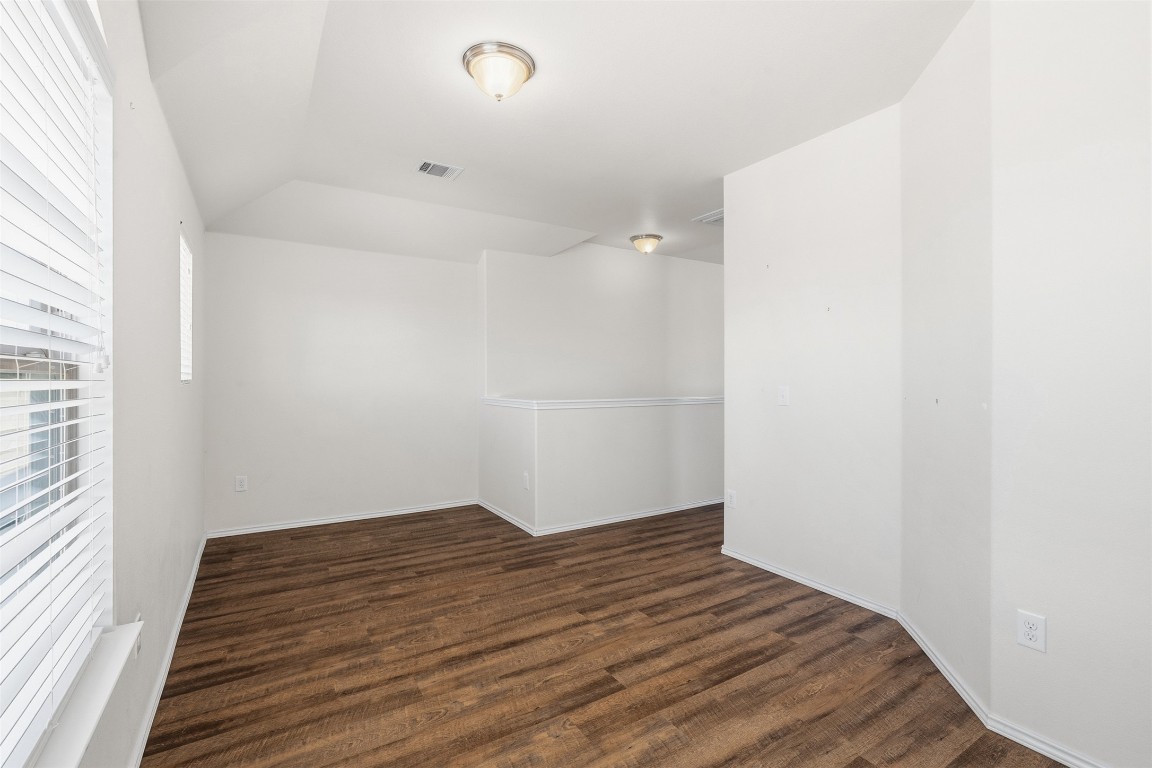 160 Albatross Cove Buda, TX 78610 - Photo 18 of 36 a view of wooden floor and windows in a room
