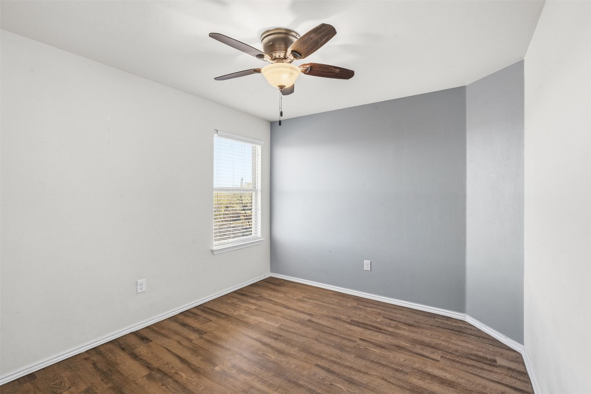 160 Albatross Cove Buda, TX 78610 - Photo 23 of 36 wooden floor in an empty room with a window