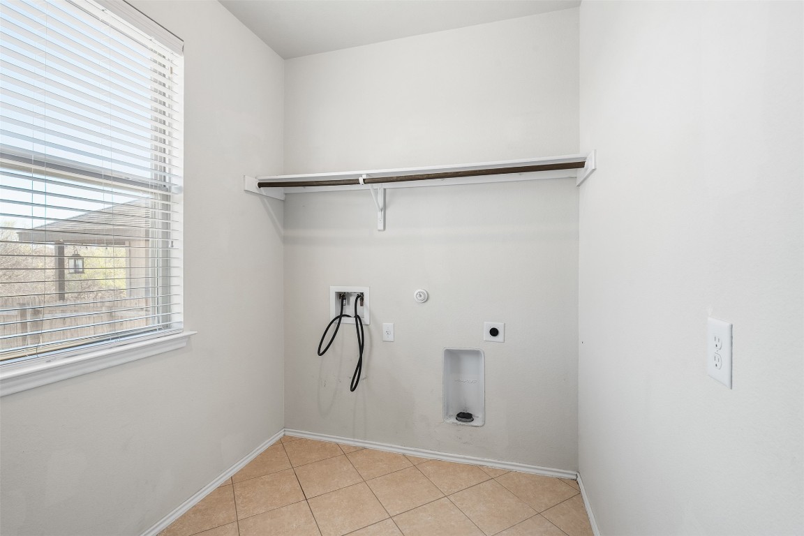 160 Albatross Cove Buda, TX 78610 - Photo 30 of 36 a bathroom with a shower