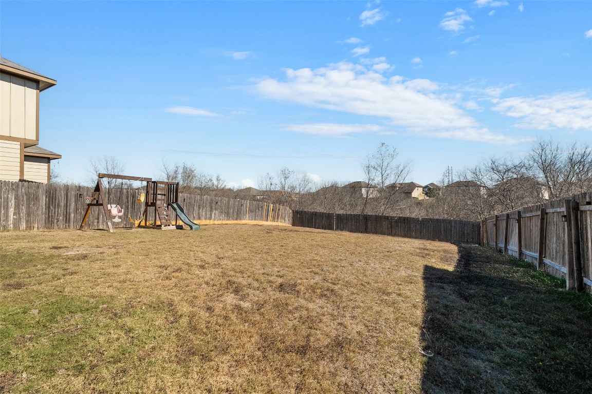 160 Albatross Cove Buda, TX 78610 - Photo 33 of 36 a view of a lake with a big yard