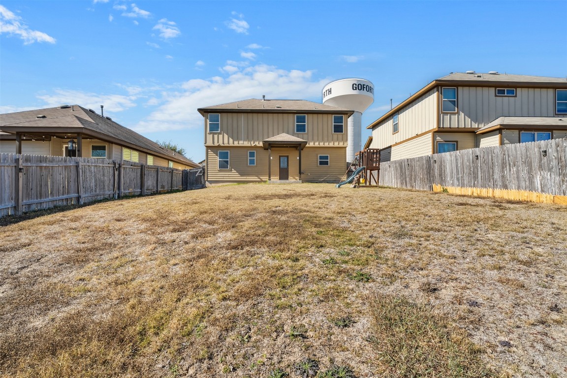160 Albatross Cove Buda, TX 78610 - Photo 34 of 36 a view of a house with a yard