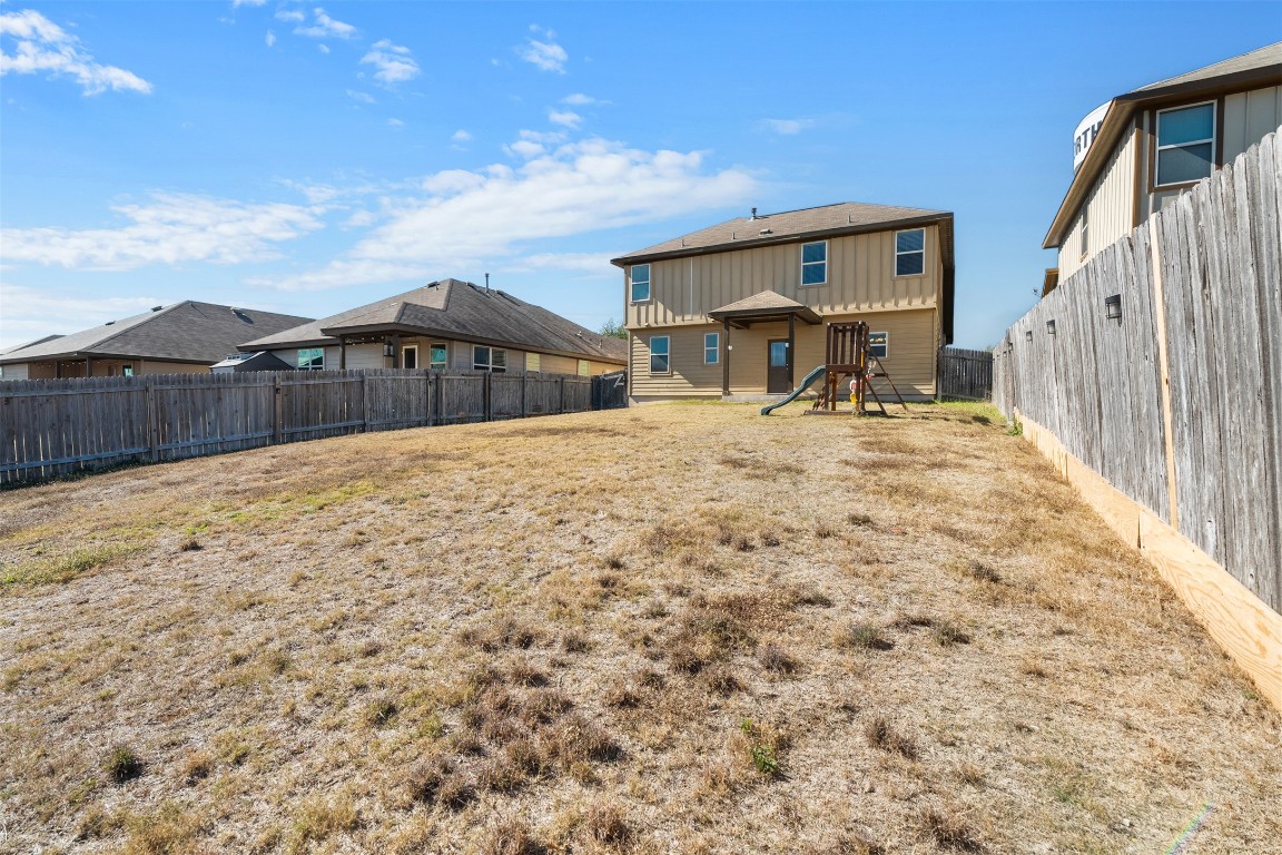 160 Albatross Cove Buda, TX 78610 - Photo 35 of 36 a view of a house with a yard