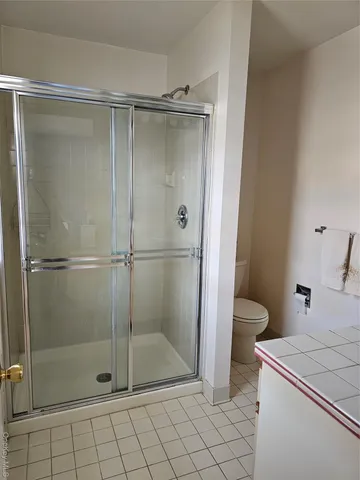 a bedroom with bed and a window